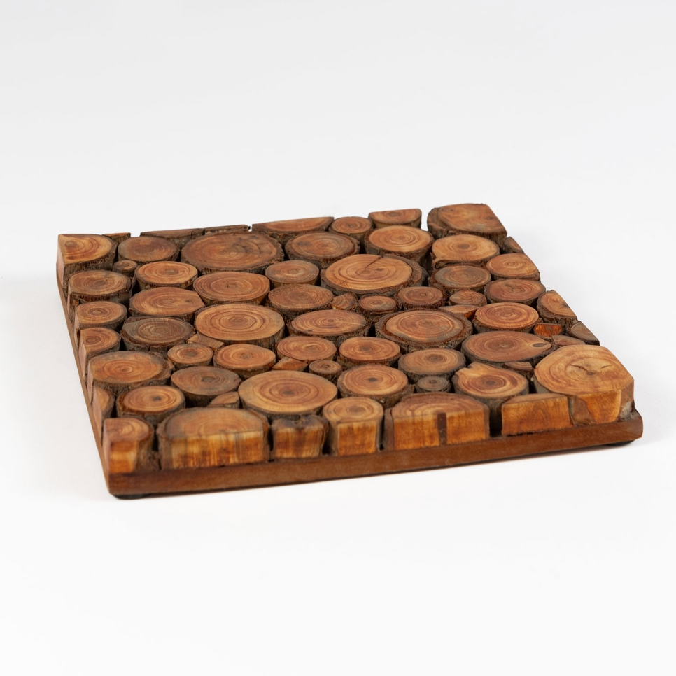 Square trivet made out of slices of mango wood