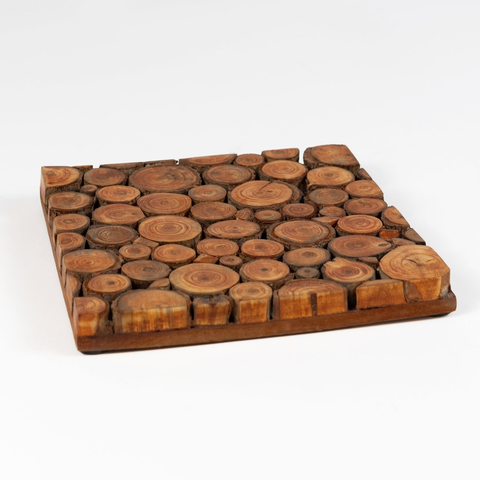 Square trivet made out of slices of mango wood