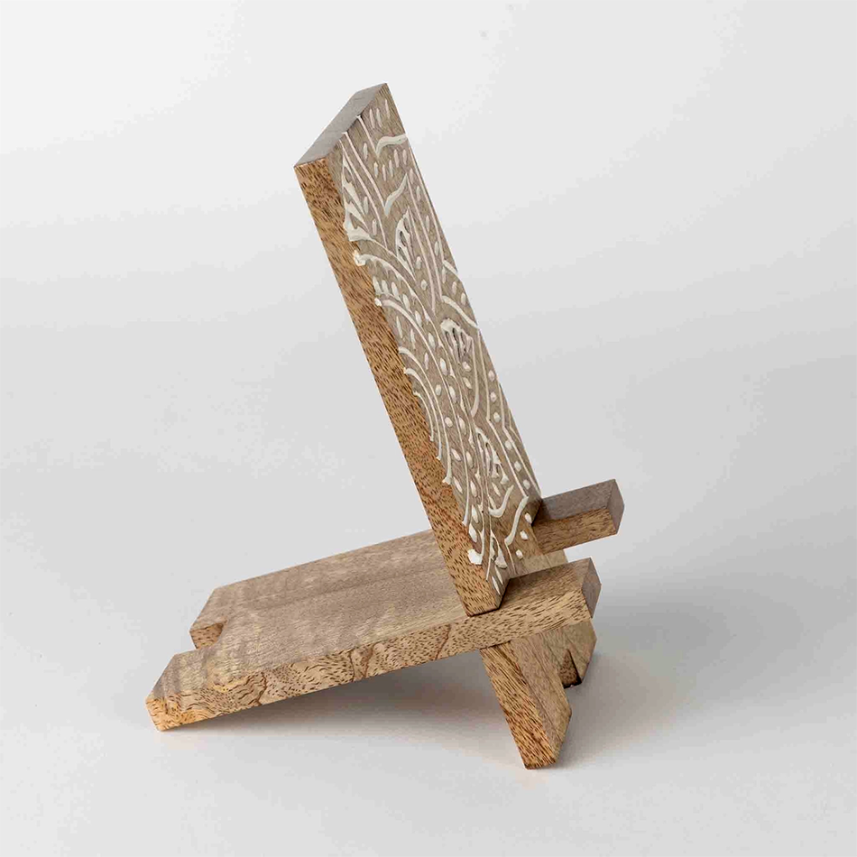 Wood smartphone stand with white painted mandala design.