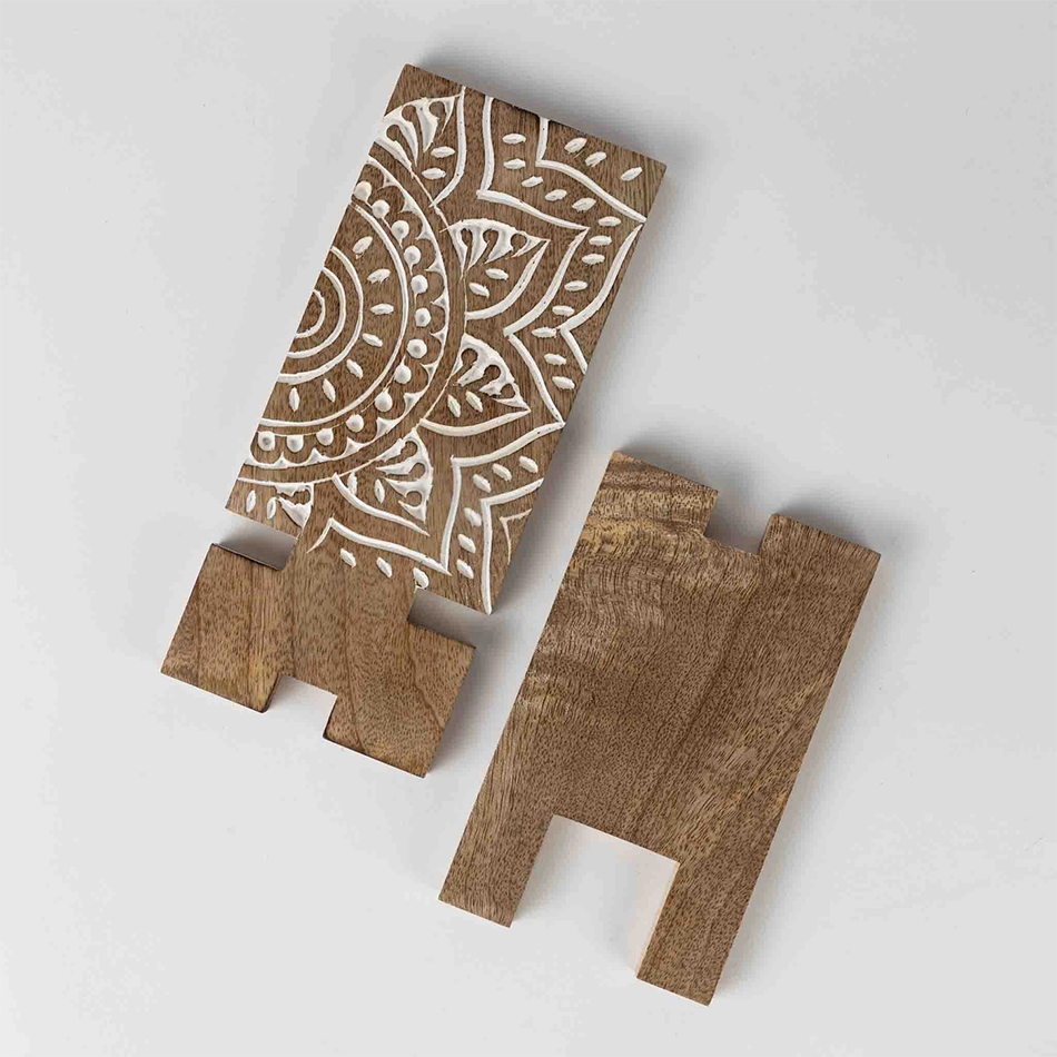 Wood smartphone stand with white painted mandala design.