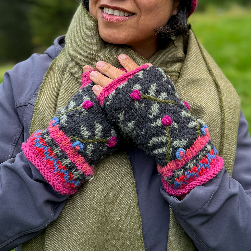 Wool knit fingerless gloves pink black embroidered design on model