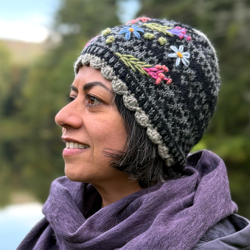 Wool knit hat black gray with embroidered flowers on model