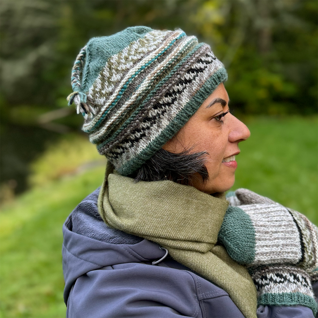 Wool knit hat with earth tones design on model