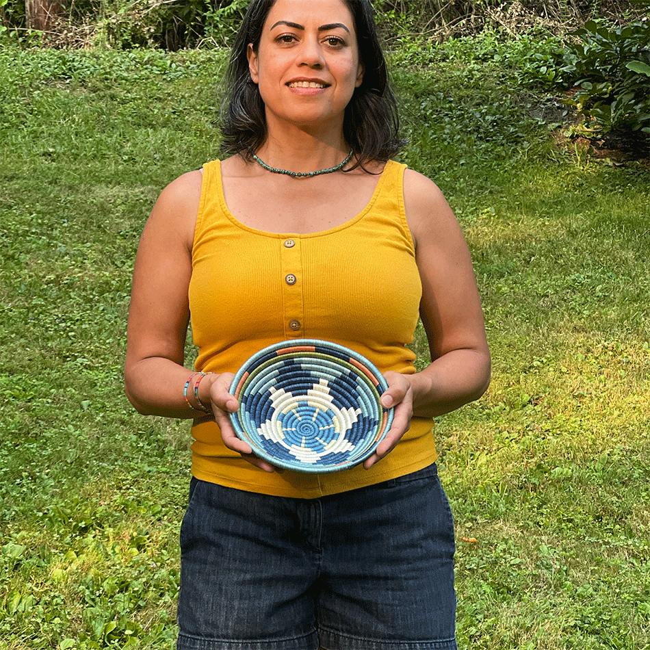 Model holding a sample of a small basket