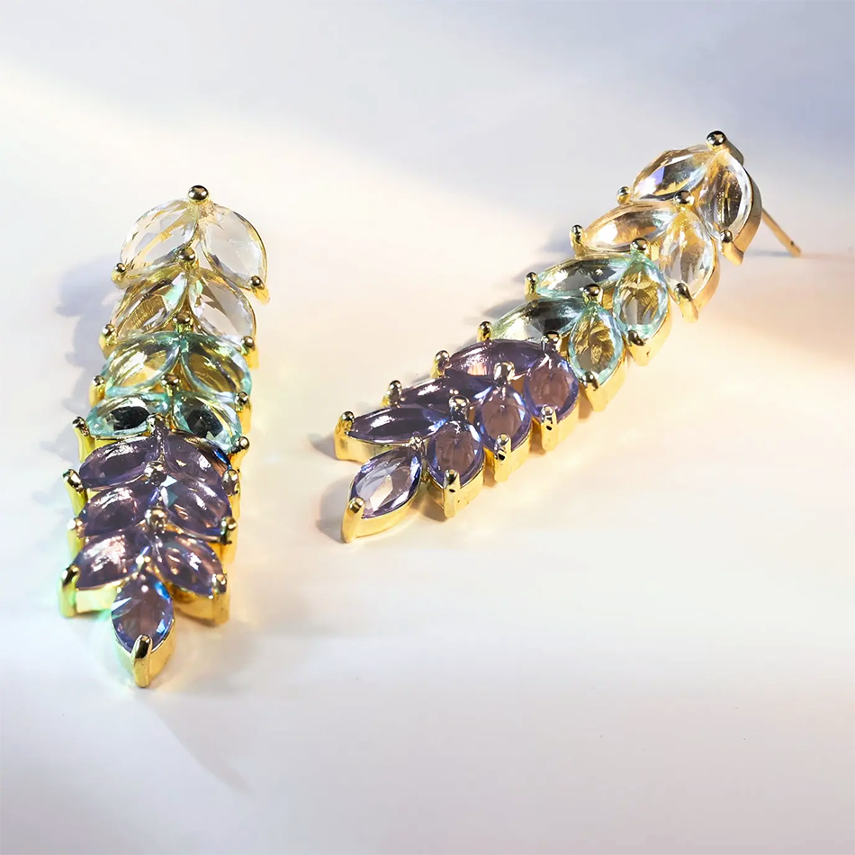 Fair trade earrings with a long chandelier made of colorful crystals.