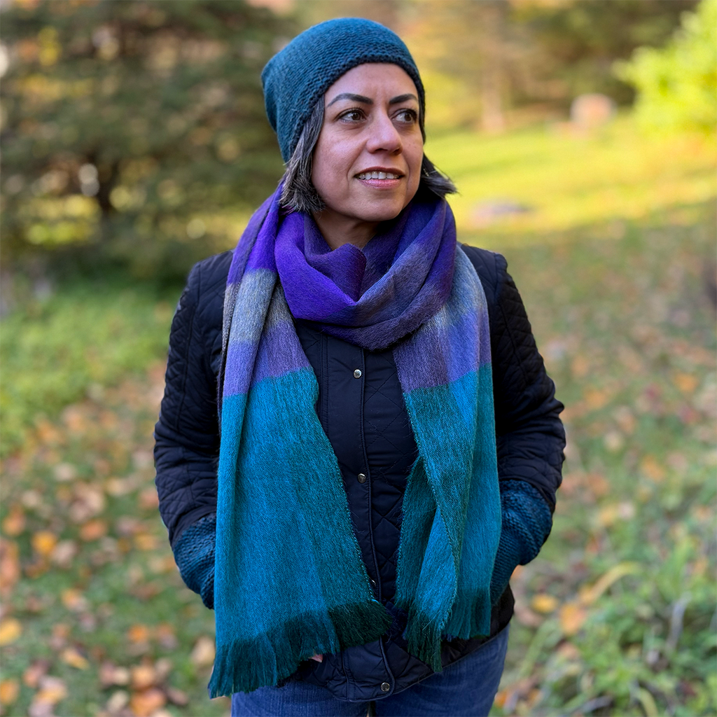Alpaca scarf with teal purple and gray plaid  on model