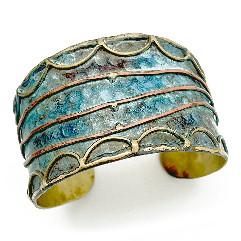 Blue brass patina wide cuff with gold and copper line design.
