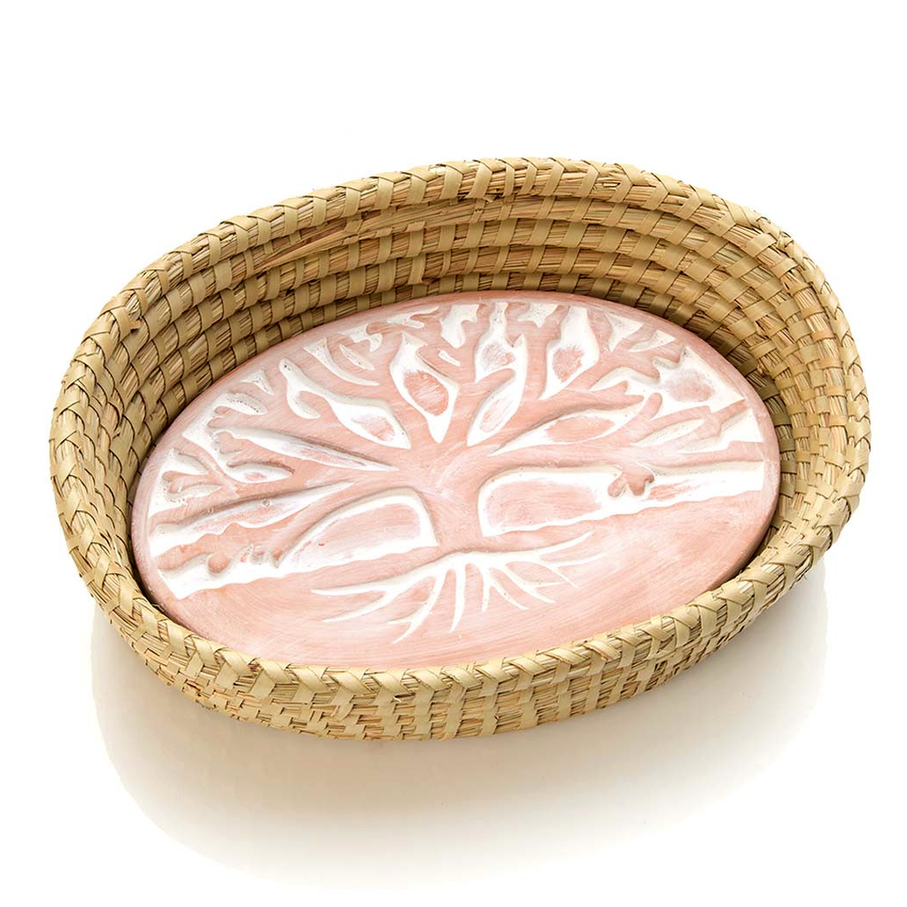 Basket with ceramic bread warmer inside with tree design.