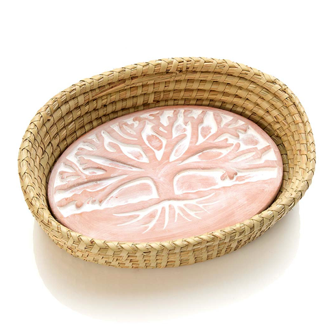 Basket with ceramic bread warmer inside with tree design.
