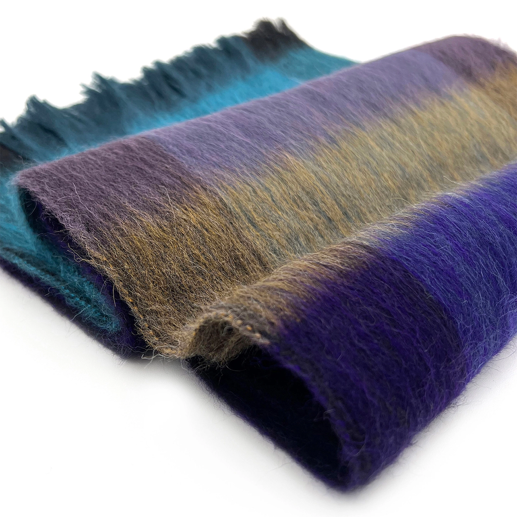 Alpaca scarf with teal purple and gray plaid  on model