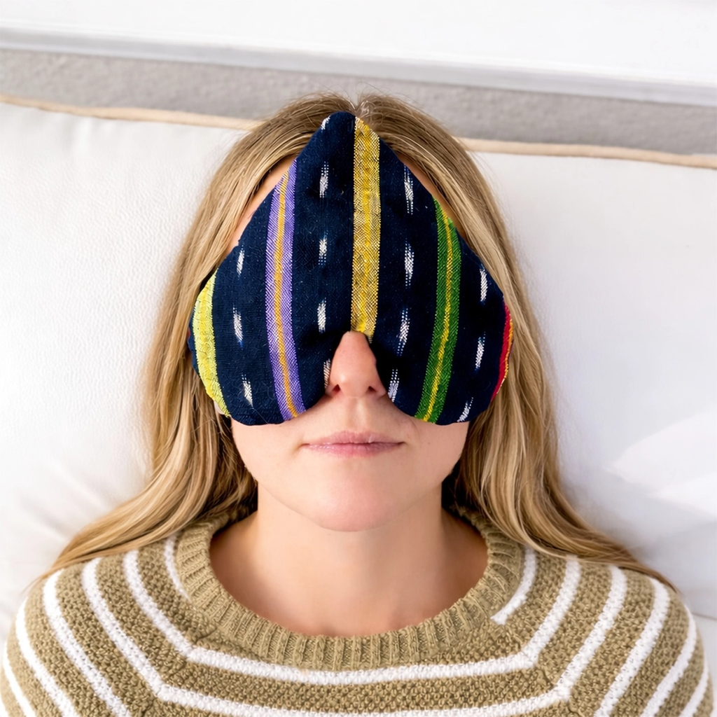 Cotton striped heart-shaped eye pillow on face