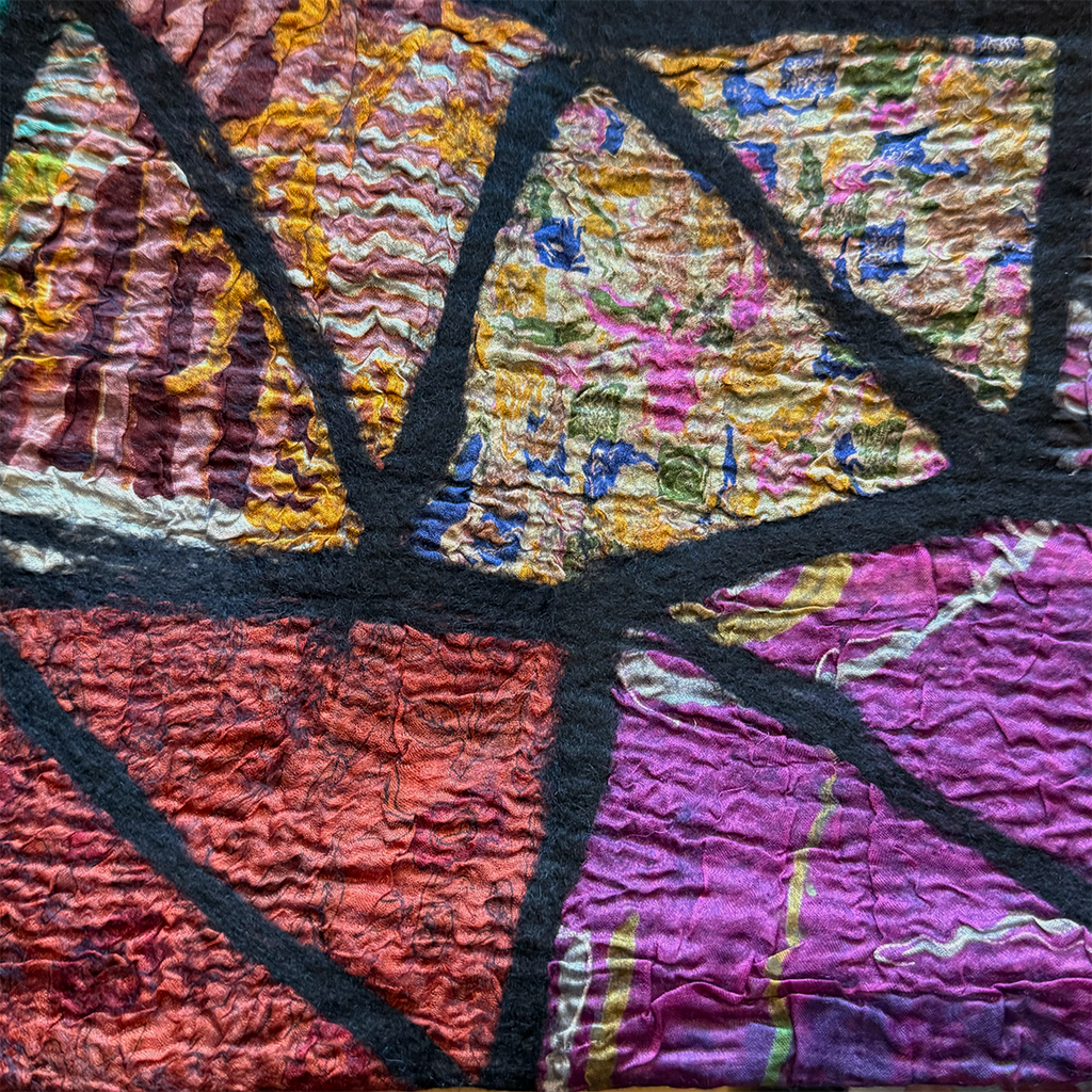 Silk felted scarf with a colorful patchwork mosaic design close-up