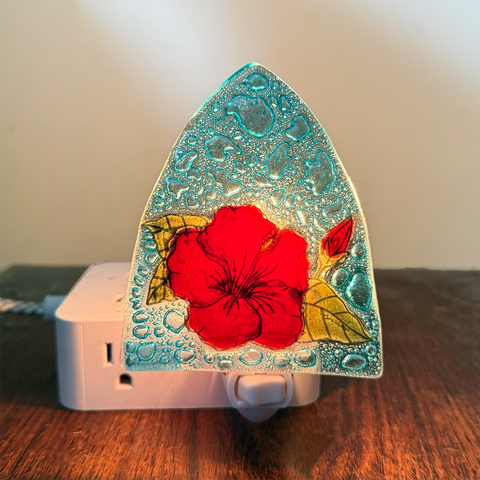 Glass nightlight with red hibiscus flower