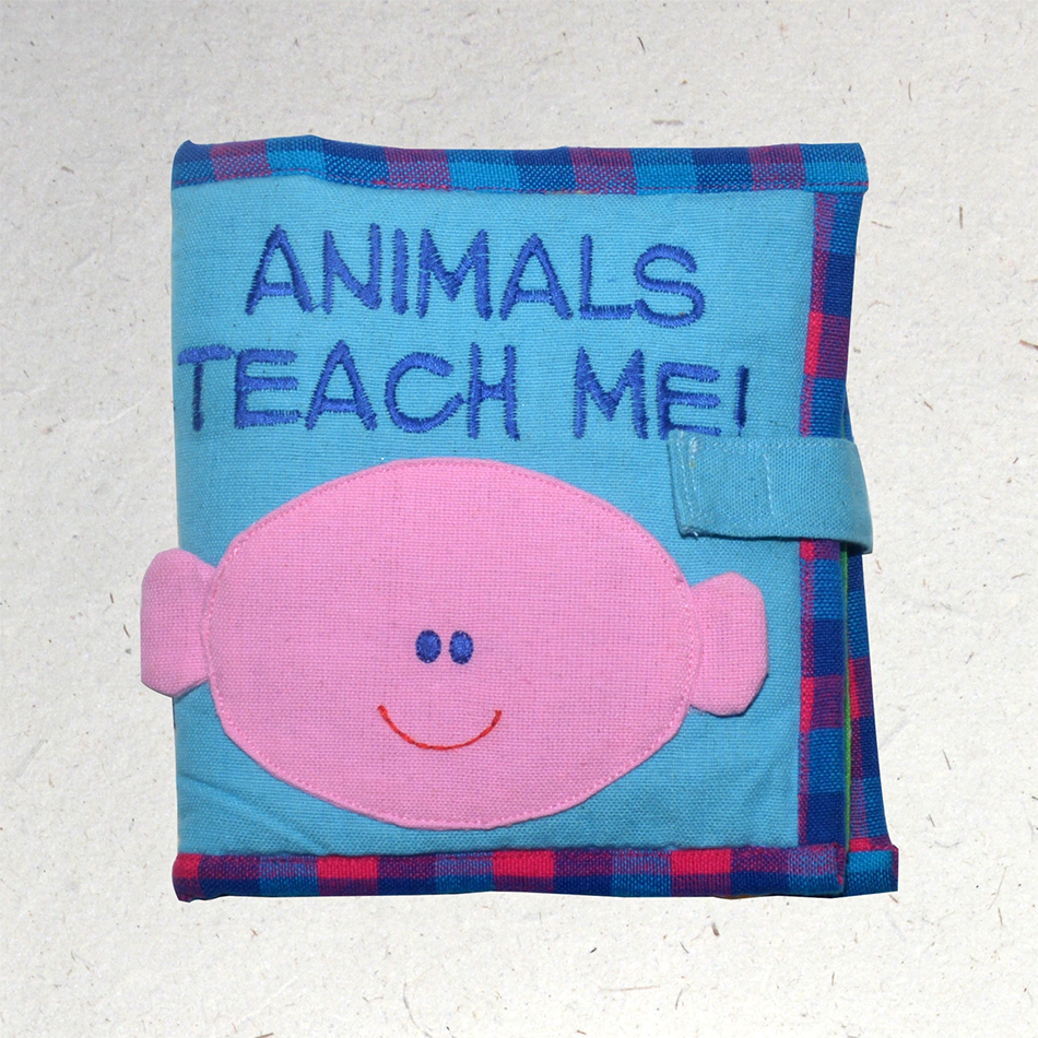Kid's cotton book about says Animals Teach Me on cover