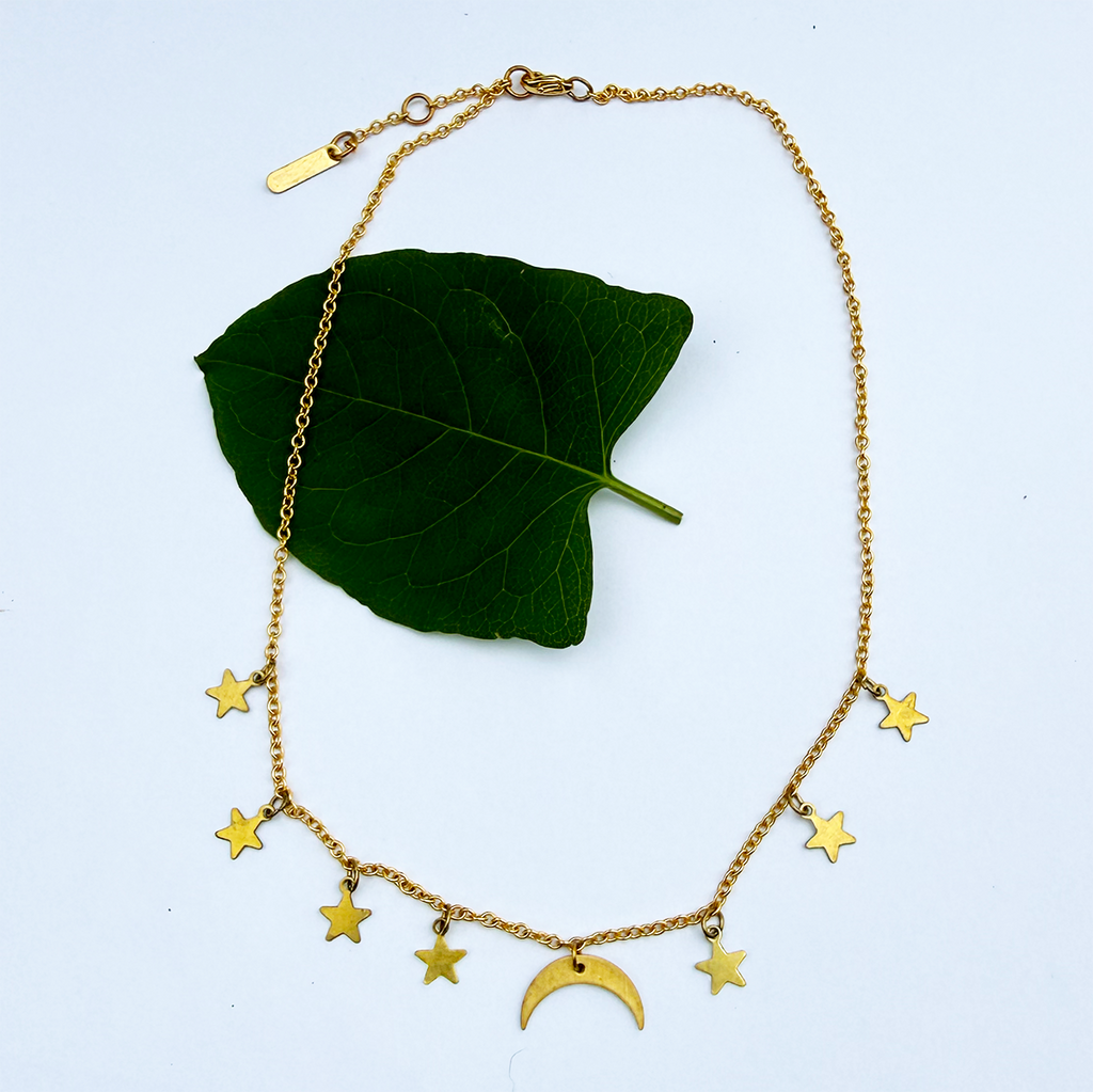 Brass necklace with delicate chain and moon and stars charms.