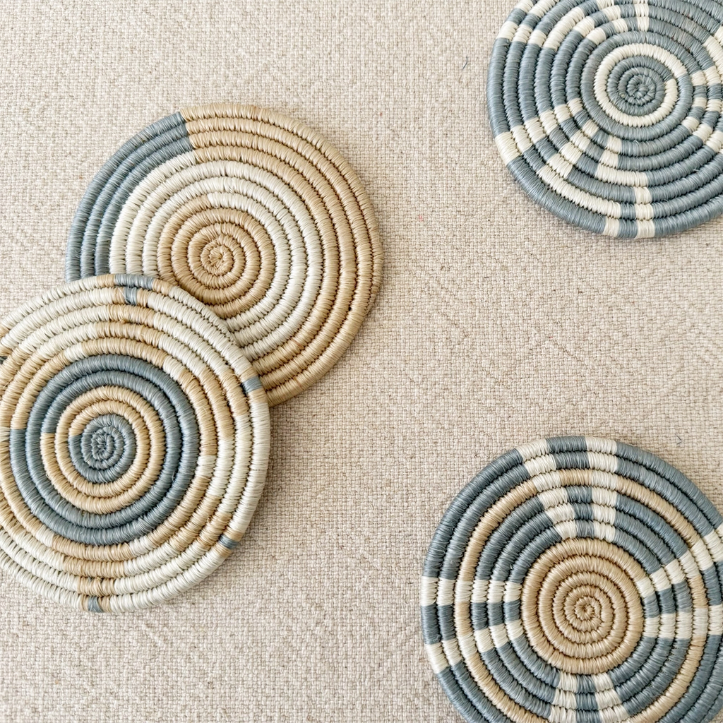 Set of 4 handwoven coasters round light blue tan white geometric pattern