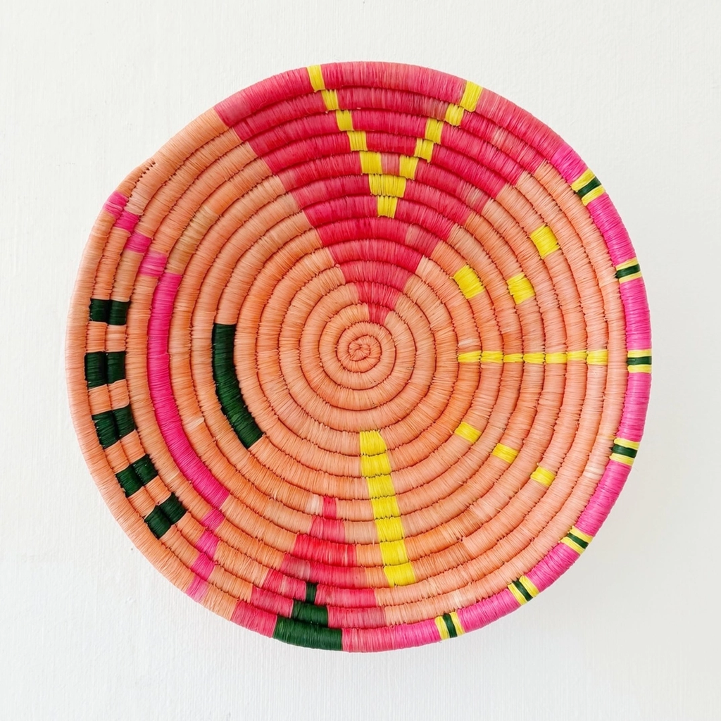 Round handwoven basket orange pink black yellow