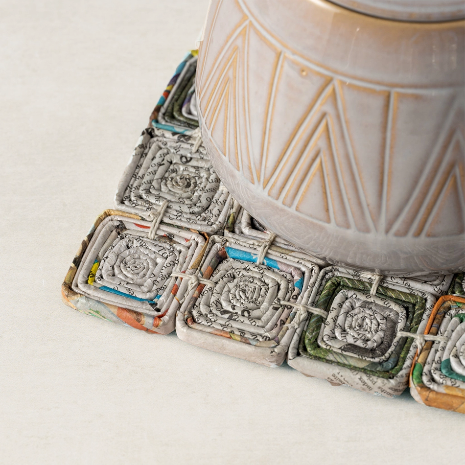 Square trivet made of recycled newspaper
