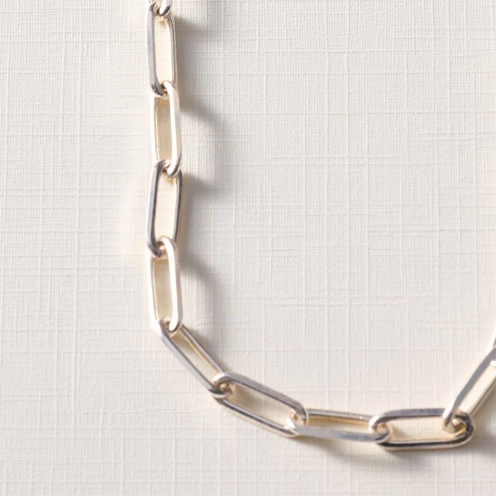Silver-plated chain link necklace close up