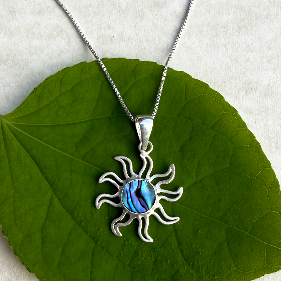 Sterling silver sun pendant with abalone in the center