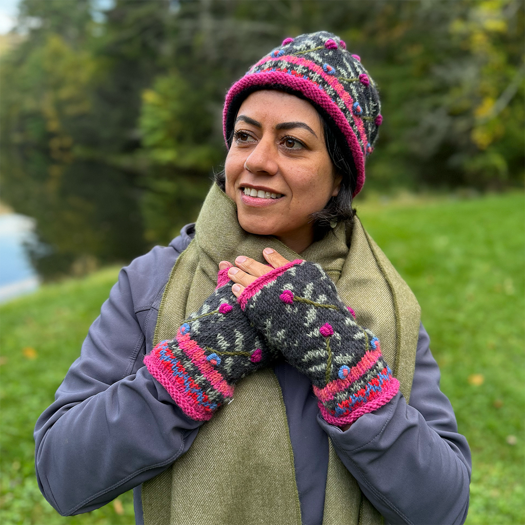 Wool knit fingerless gloves and hat pink black embroidered design on model