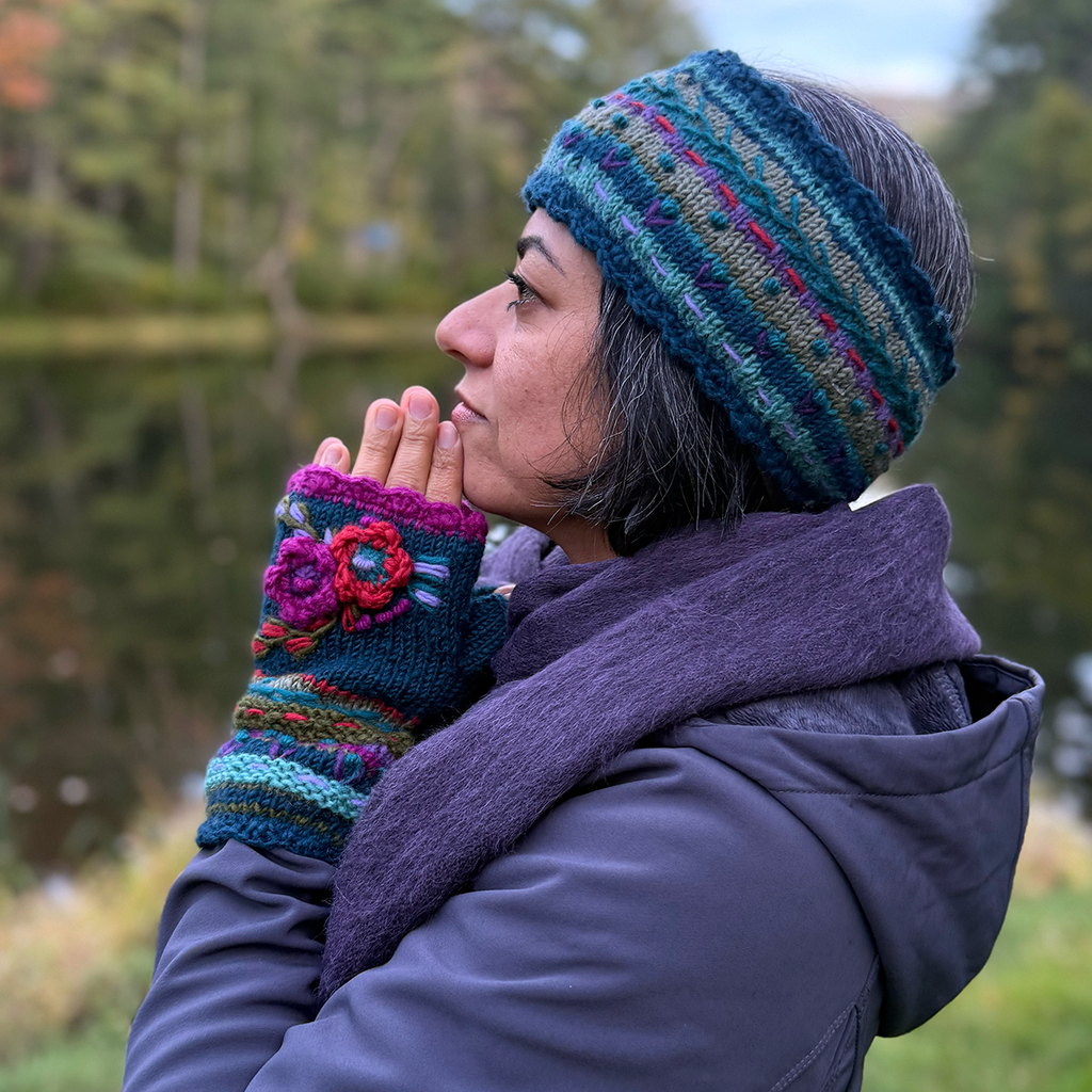Wool knit fingerless gloves and headband  teal with red and pink embroidered flowers on model