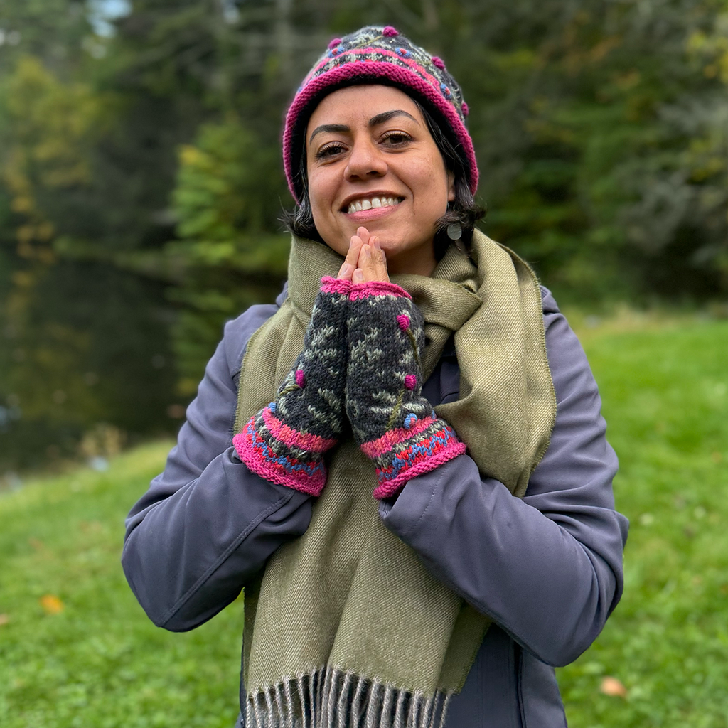 Wool knit fingerless gloves and hat pink black embroidered design on model