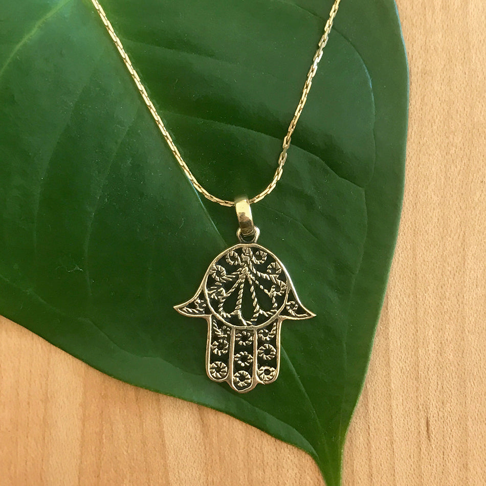 Fair trade brass hamsa necklace