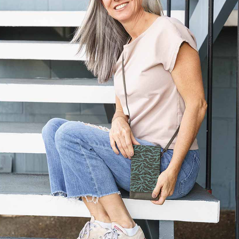 Recycled cotton cell phone bag handmade by human trafficking survivors in Cambodia.