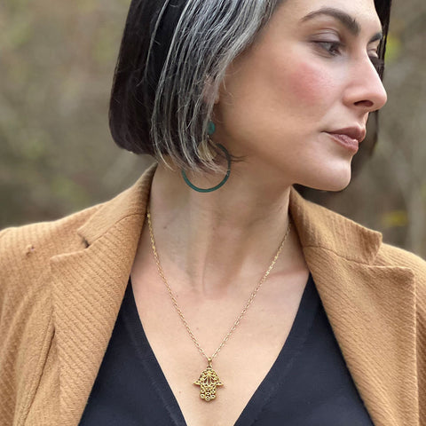 Fair trade brass hamsa necklace