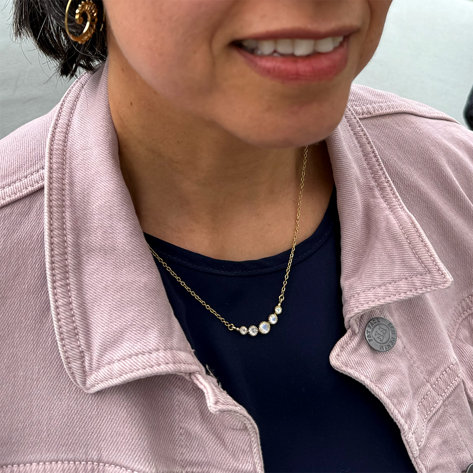 Brass necklace with 5 small moonstones and delicate chain.