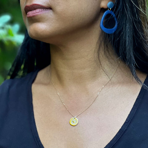 Fair trade heart gold necklace handmade by survivors of human trafficking