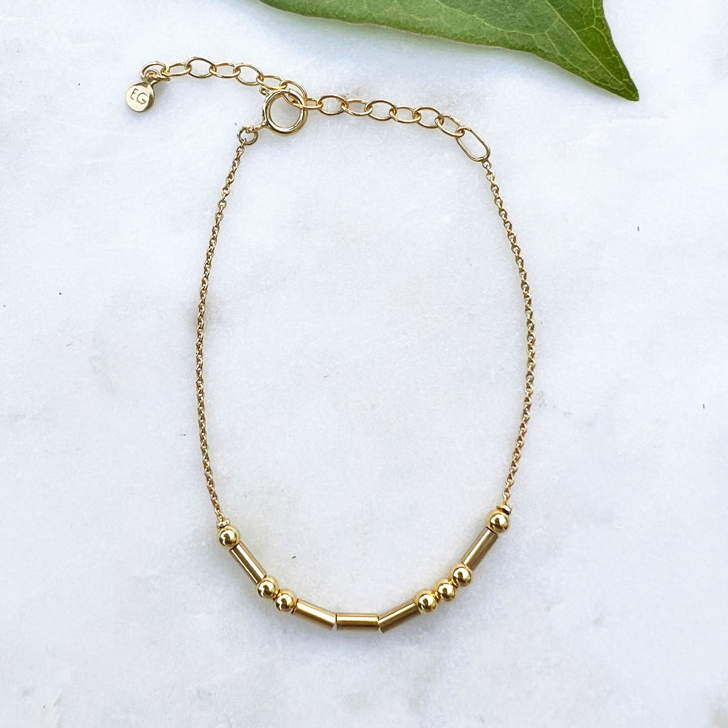 Gold morse code love bracelet handmade by survivors of human trafficking in Thailand