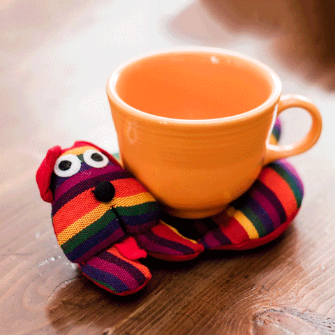 Fair trade rainbow heated trivet