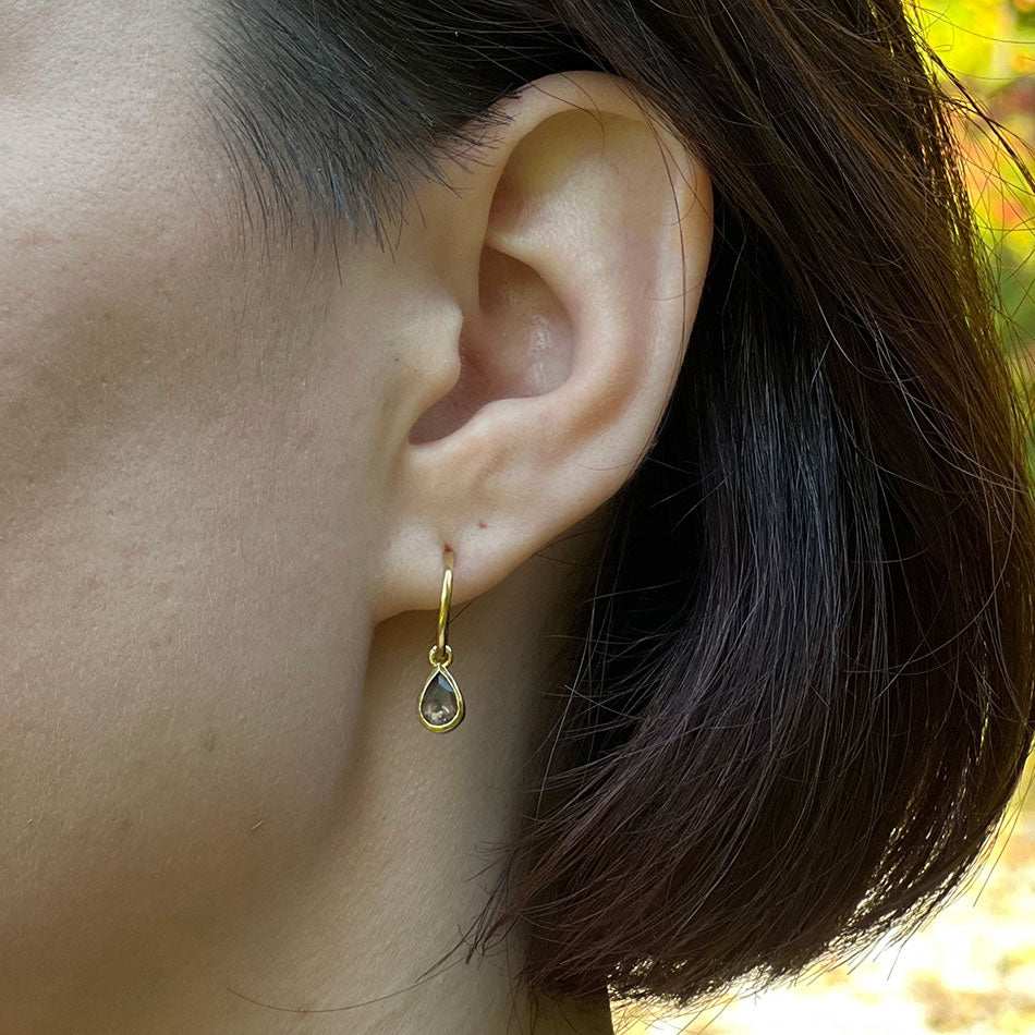 Fair Trade brass smokey-quartz earrings handmade in India on model