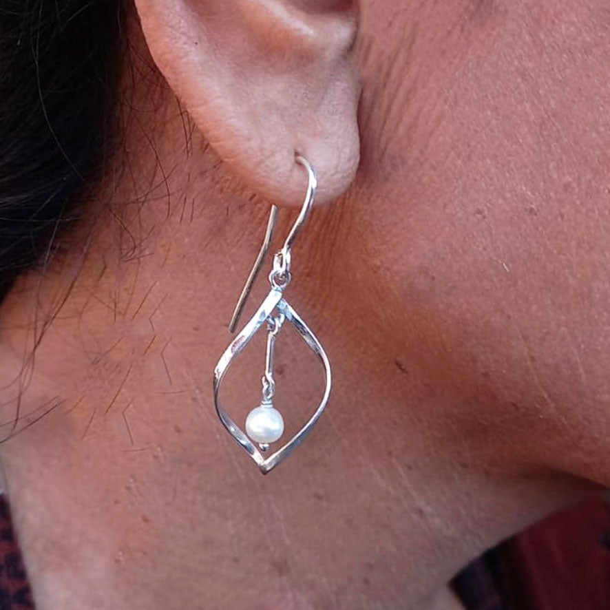 Ethically handmade sterling silver pearl earrings Bali on model