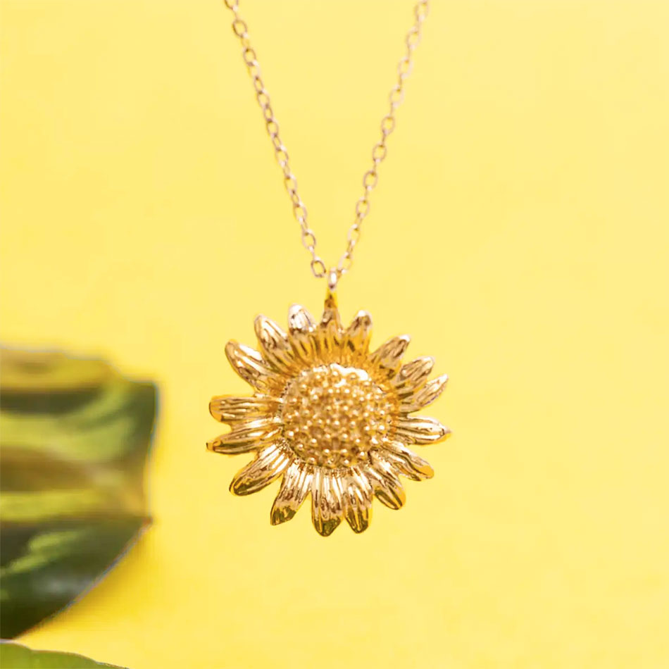 Sunflower necklace handmade by survivors of human trafficking