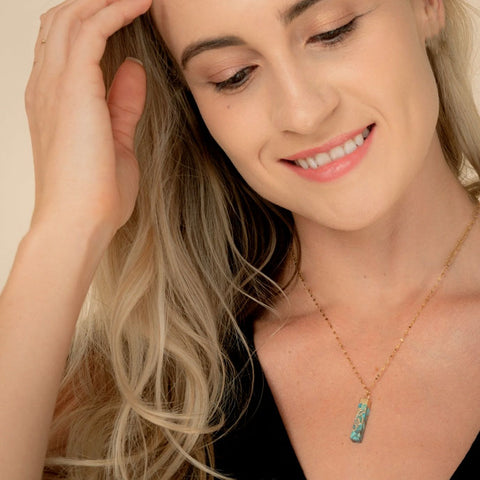 Fair trade turquoise bar necklace handmade by survivors of human trafficking