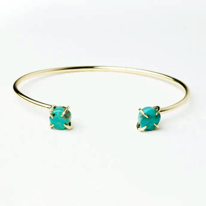 Turquoise cuff handmade by survivors of human trafficking