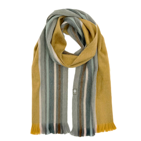 Alpaca scarf on model with gold, gray and blue stripes