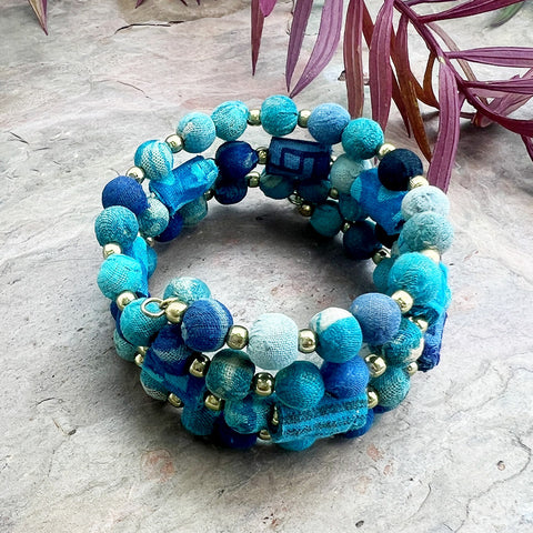 Fair trade recycled sari coil bracelet handmade by artisans in India.