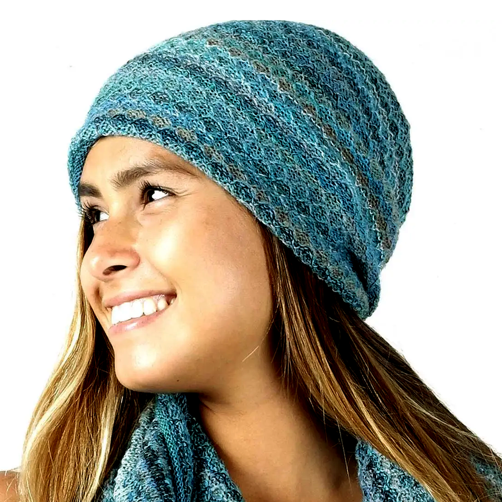 Fair trade baby alpaca hat with blues and greens.