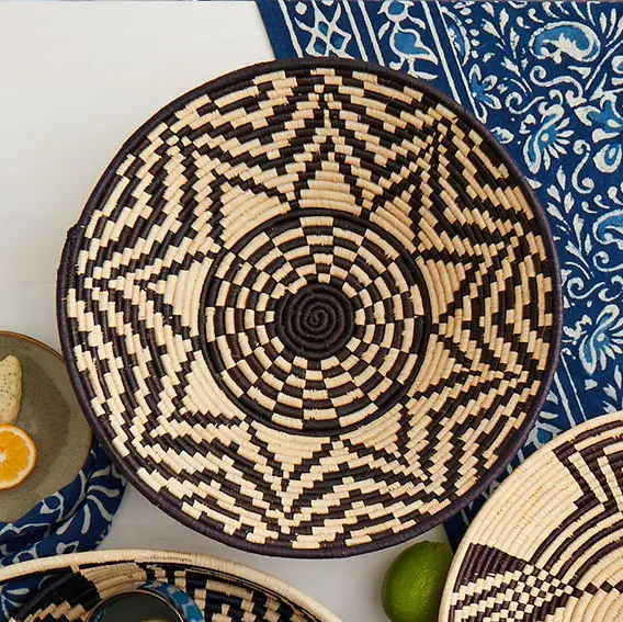 Fair trade black and tan handmade basket with star design.