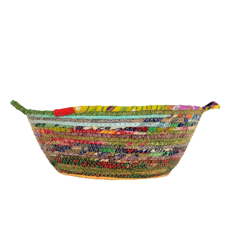 Colorful air trade basket made out of recycled sari fabric.