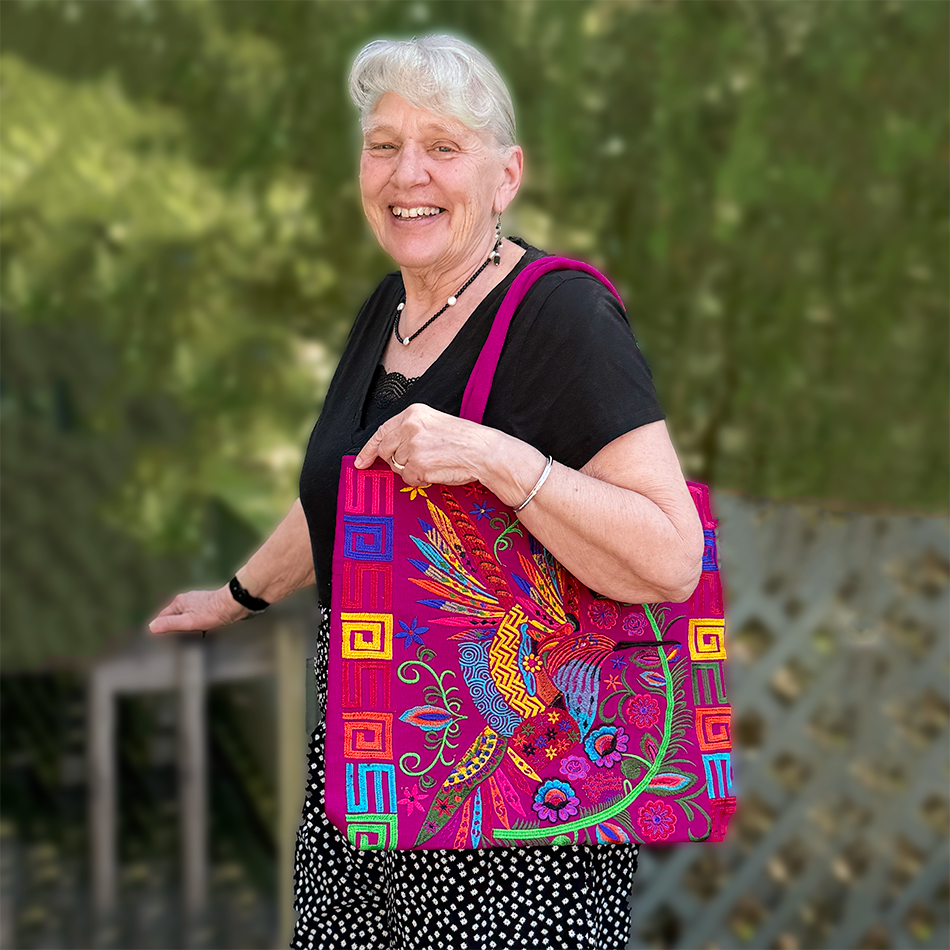 Large pink embroidered tote bag with colorful birds