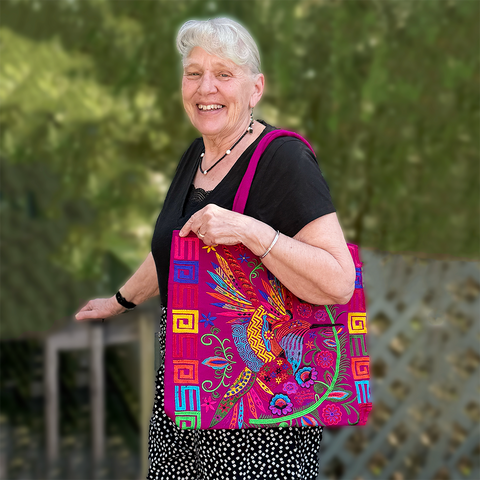Large pink embroidered tote bag with colorful birds