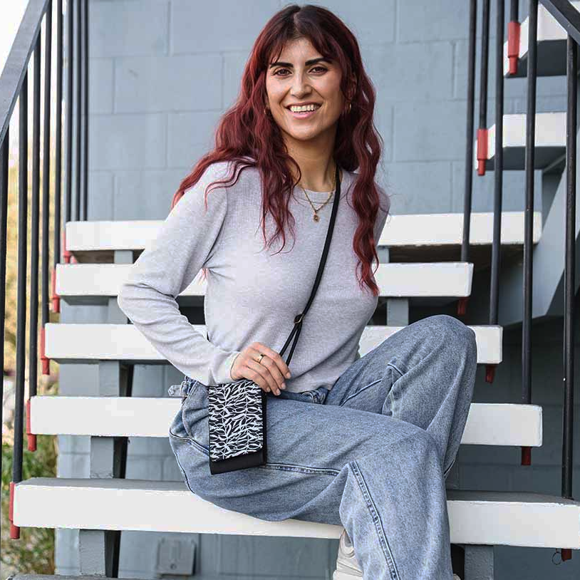 Recycled cotton cell phone bag handmade by human trafficking survivors in Cambodia.