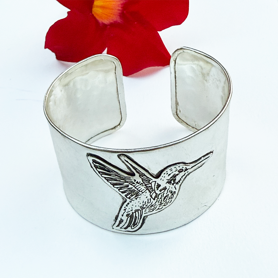 Fair trade silver hummingbird wide cuff bracelet.