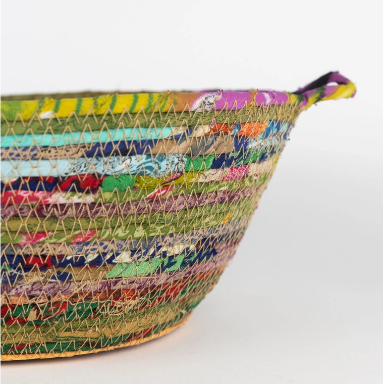 Colorful fair trade basket handmade from recycled saris.