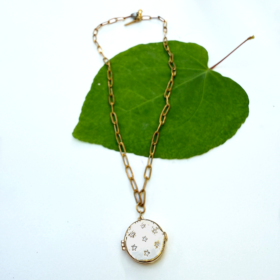 Fair trade gold-plated locket with crystal stars.